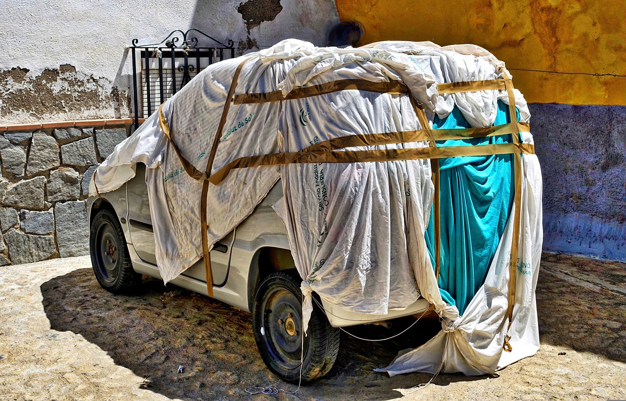 Car covered with tarp